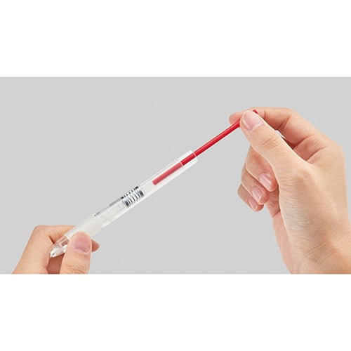 Neon Pitu fluorescent pink pencil held in hand showing vibrant color and writing angle demonstration