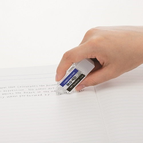 Tombow Mono Pocket correction tape in-use demonstration on typed document, showing 5mm width application