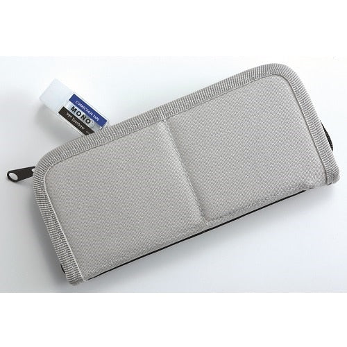 Mono-Pocket correction tape storage case with product label, showing compact gray pouch design for organizing multiple tape…
