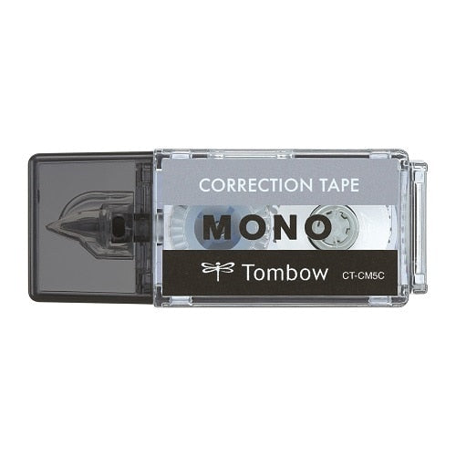 Tombow Mono correction tape dispenser showing transparent housing with black roller mechanism and product branding detail