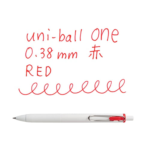Uni-ball One 0.38mm red gel pen writing sample with handwriting demonstration and pen positioned horizontally below