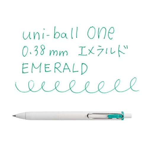 Uni-ball One 0.38mm emerald gel pen writing sample showing smooth emerald ink lines and pen angle view