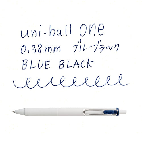 Uni-Ball One 0.38mm gel pen in blue-black with writing sample showing smooth line detail and pen angle view